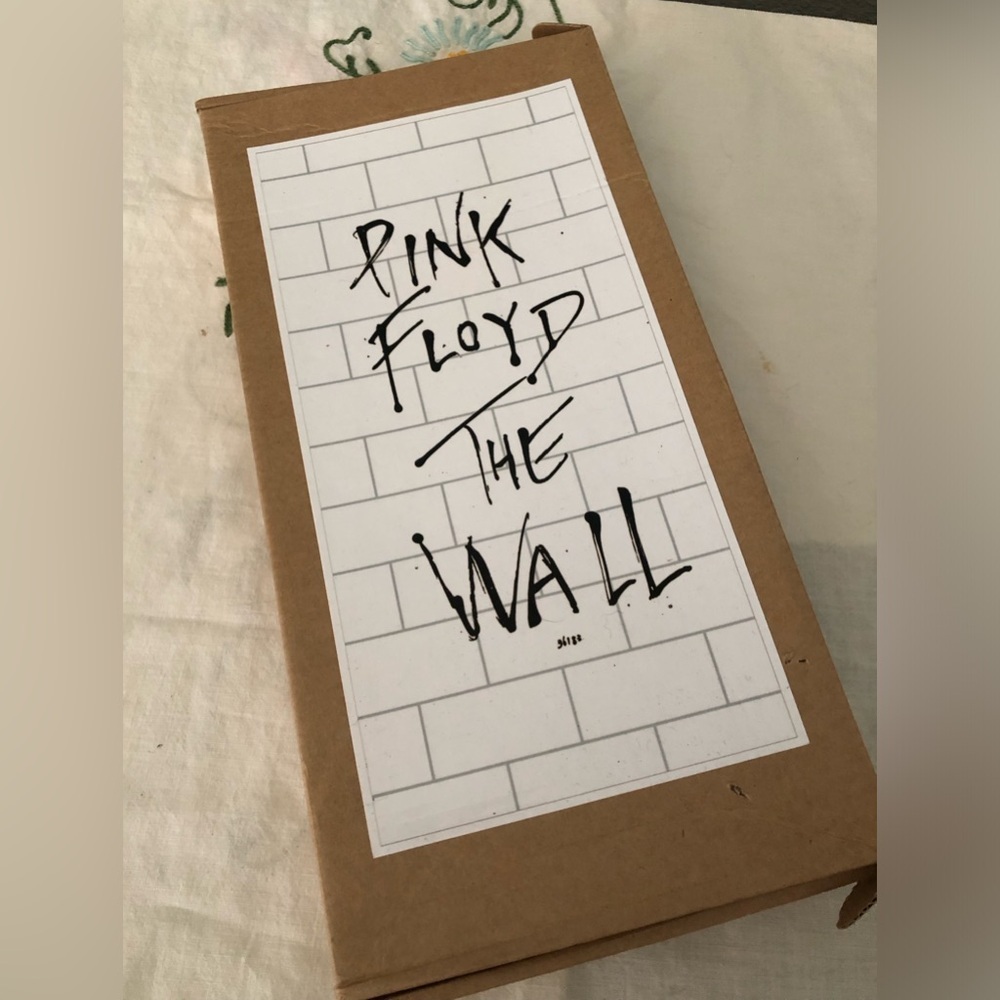 Pink Floyd "The Wall" Jigsaw Puzzle packaged in a simple cardboard box.